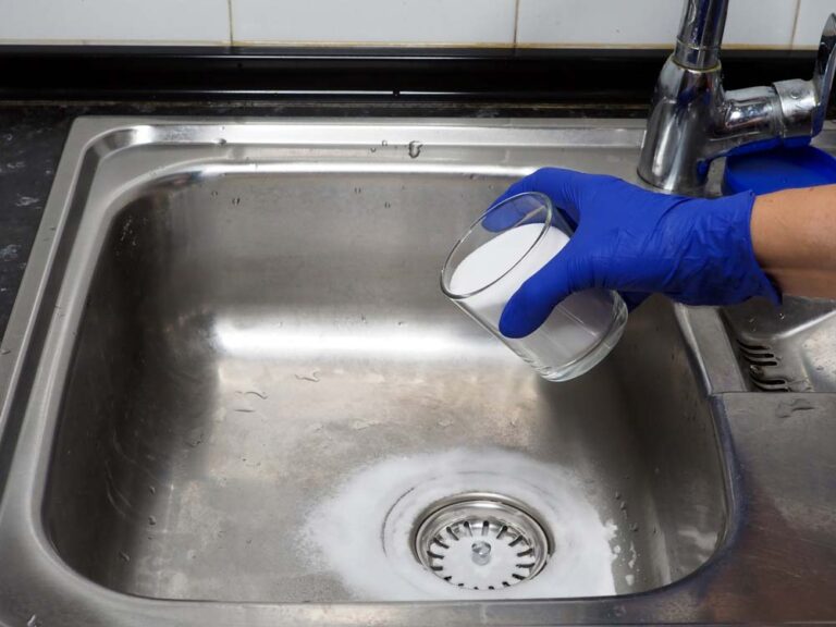 hand putting baking soda on drain Mansfield, TX